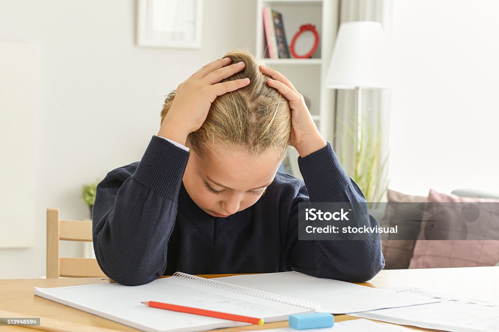 Bored boy doing homework Tired boy doing homework Child Stock Photo