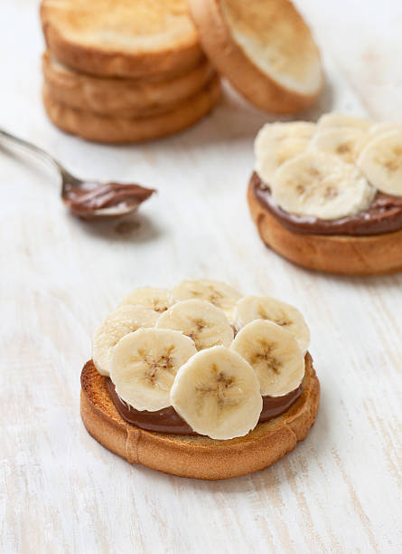 istock toast with banana and chocolate cream 513949032