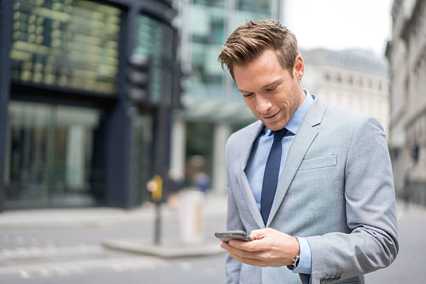 istock Business man texting on his phone 513949428