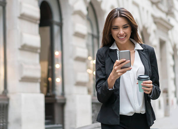 istock Business woman texting on her phone 513949462