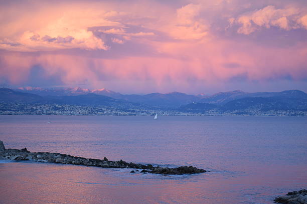 Pink Sunset in Antibes and over Southern French Alps stock photo