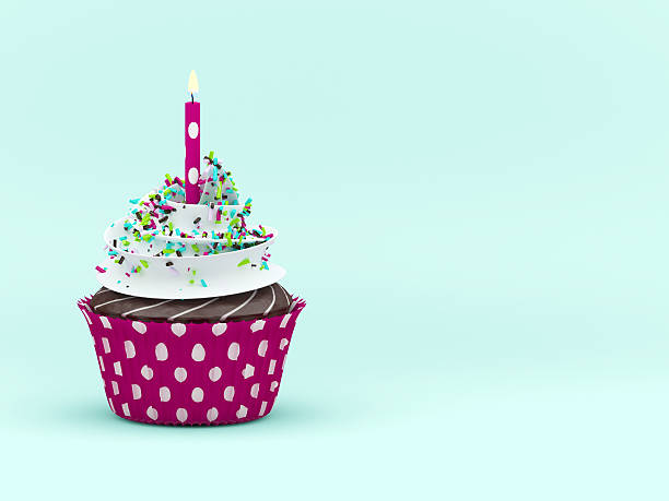 istock sweet cupcake with candle over light blue background 513949818