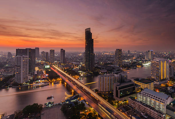 istock Bangkok view twilight color Chao Phraya River bridge thailand 513950092