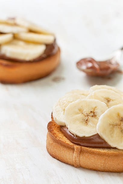 istock toast with banana and chocolate cream 513950462