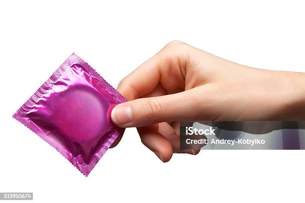 Condom In Hand Stock Photo - Download Image Now - Condom, AIDS, Adult