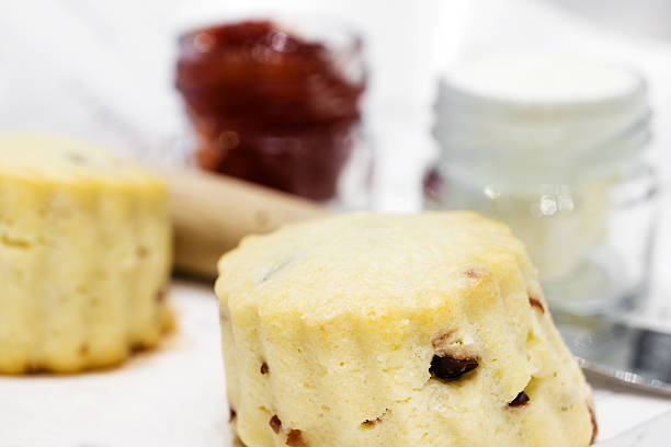istock scone with strawberry jam and cream 513951046