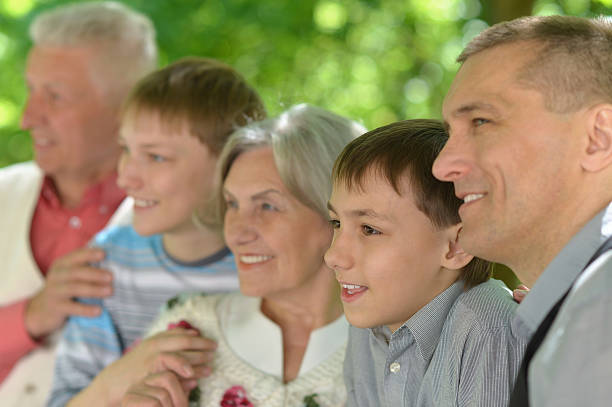 istock Family relaxing in summer park 513951168