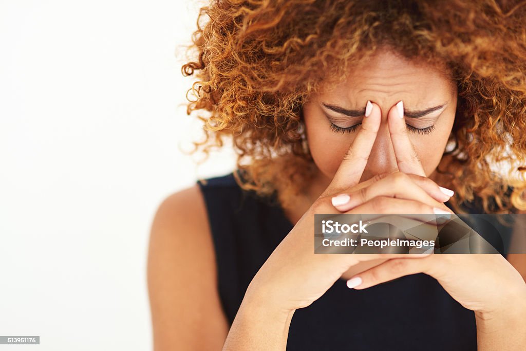 Her head is filled with worries Shot of a young businesswoman experiencing stresshttp://195.154.178.81/DATA/i_collage/pi/shoots/806453.jpg Headache Stock Photo