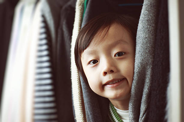istock Child playing in the closet 513951550