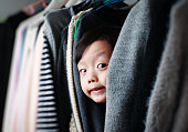 Child playing in the closet