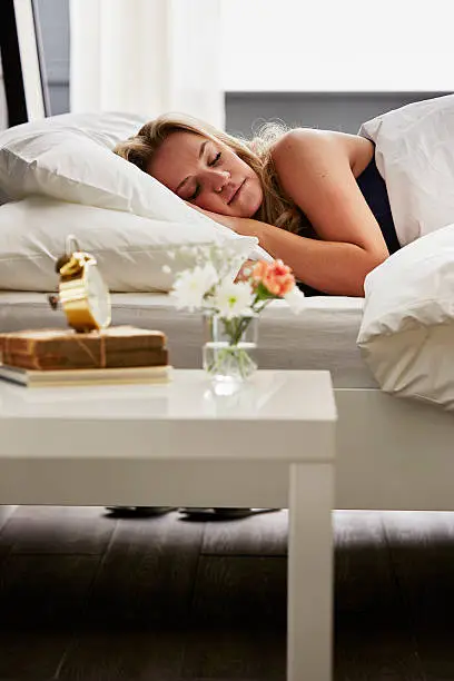 Photo of Woman asleep in bed