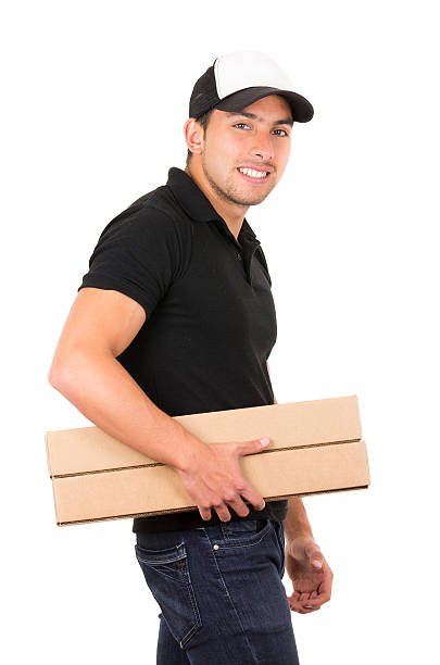 istock happy friendly confident delivery man carrying boxes 513954279
