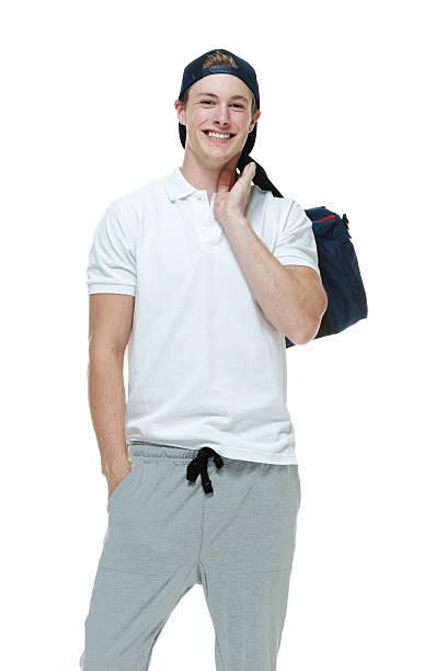 istock Smiling man holding duffle bag 513955179