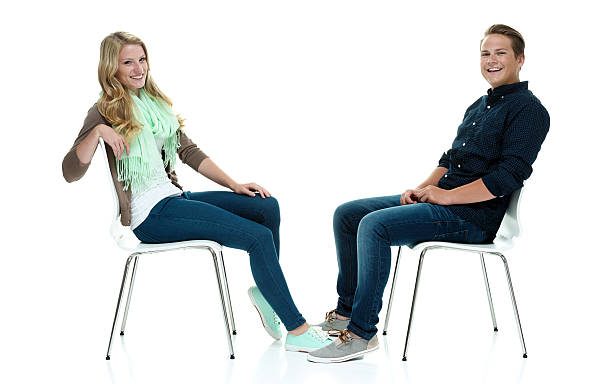 istock Cheerful couple on chair & looking at camera 513956485