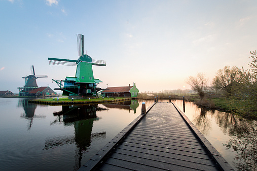 six traditional Dutch windmills at the Zaanse Schans in The Netherlands, seen from a yetty