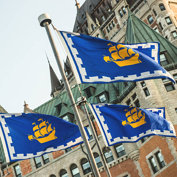 istock quebec city regional flag waving on the sky 513957057