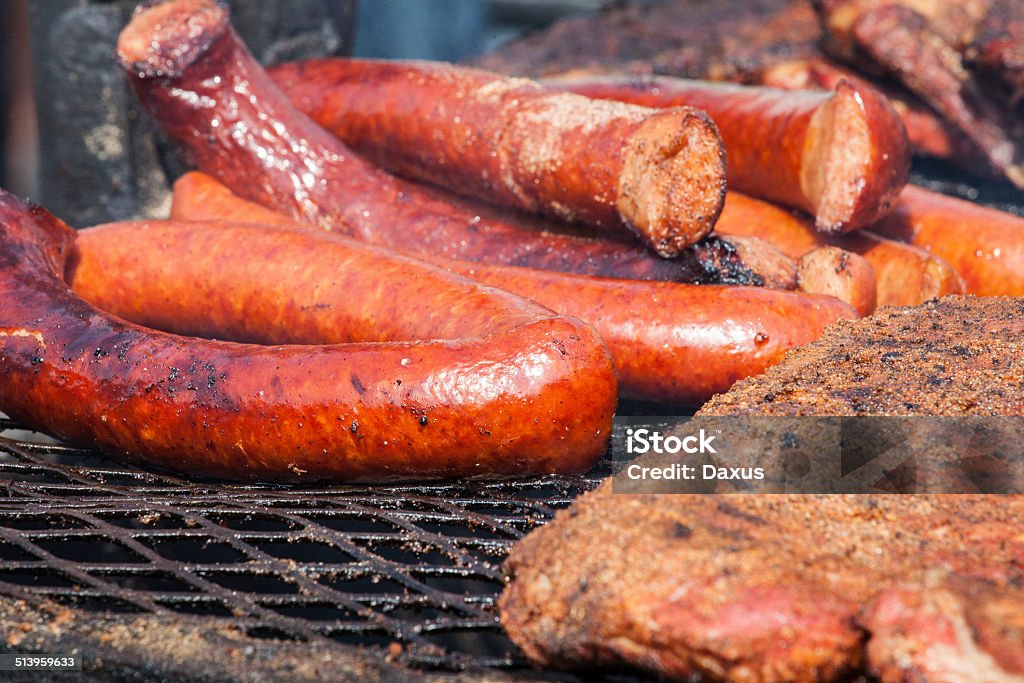 BBQ Sausage BBQ Sausage and Ribs on a outdoor wood fired grill Barbecue - Meal Stock Photo