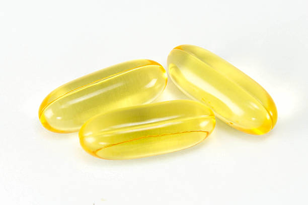 istock Cod liver oil omega3 gel capsules isolated on White background. 513959869
