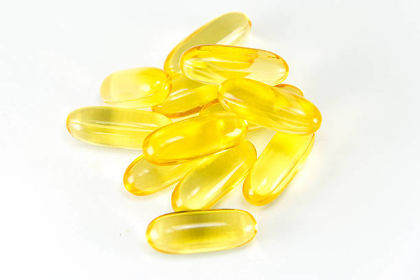 istock Cod liver oil omega3 gel capsules isolated on White background. 513959883