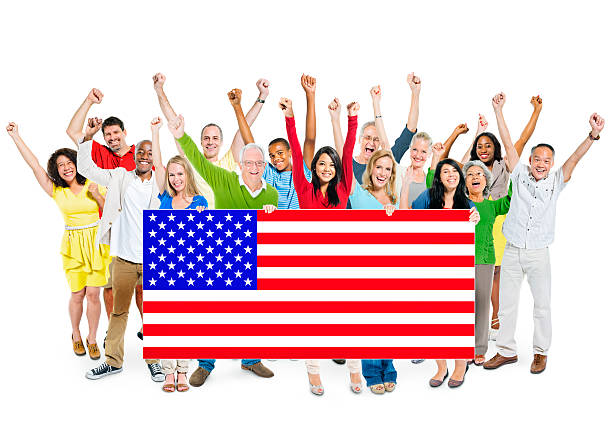 istock Group of People Standing and Holding American Flag 513960731