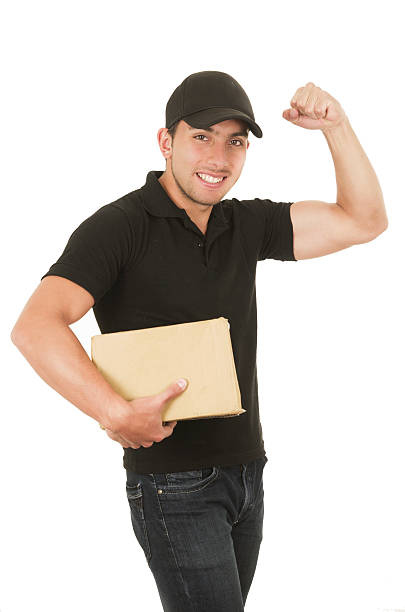 istock handsome brunette courier man holding packages 513961007