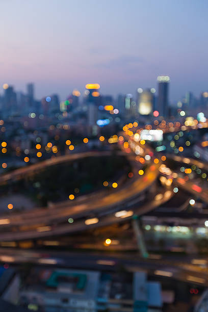 istock Abstract blurred bokeh lights over city road intersection 513982448