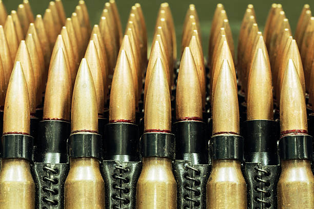istock ammo to machine guns as background 513982618
