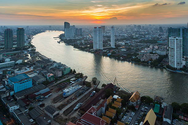 istock Sunset over Bangkok downtown with main river curved 513982694