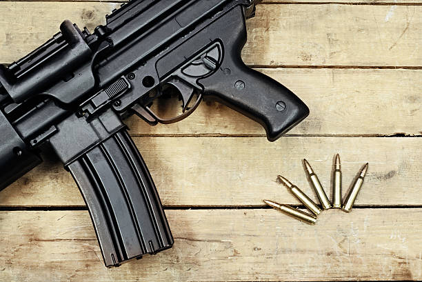 istock mashine guns and ammunitions on the wooden surface 513982970