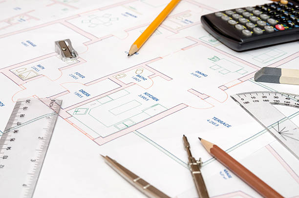 istock House plans with calculator, pencil, ruler, compass 513983562