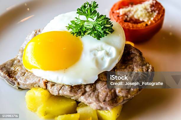 Sirloin Steak Topped With Fried Egg And Breakfast Potatoes Stock Photo - Download Image Now