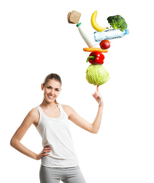 istock Beautiful young woman holding a balanced diet 513983984