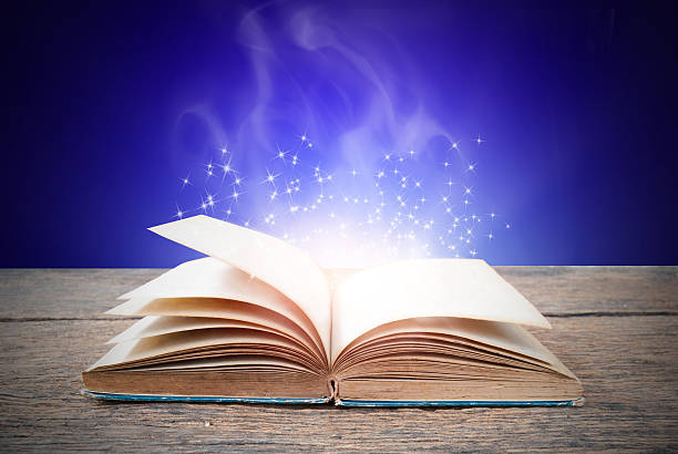 istock Abstract magic book on wooden background 513984560