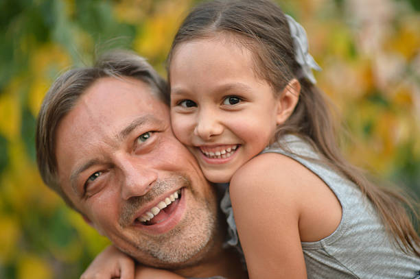 istock father with daughter in summer park 513984772