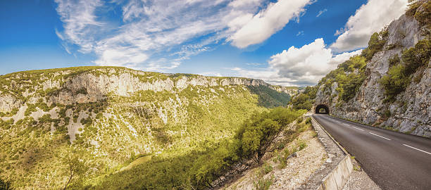 Panormamic view on street and tunnel along the beautiful Gorges de l'Ardeche in 