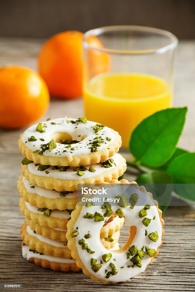 Lemon cookies with frosting and pistachios. Baked Stock Photo