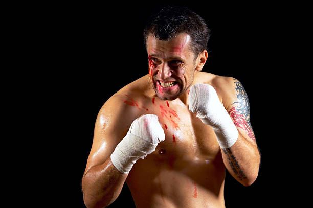 istock Aggressive boxer with blood on the face 513988873