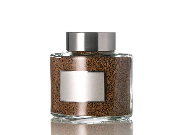 istock Instant coffee in the glass jar, Isolated on white. 513989575