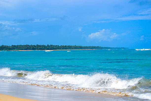 istock Waves on Carribean sandy beach on a cloudy day 513989800