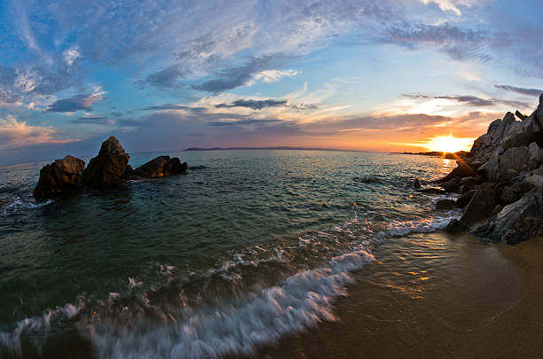 istock Sea rocks on sandy beach at sunset in Sithonia, Greece 513991654