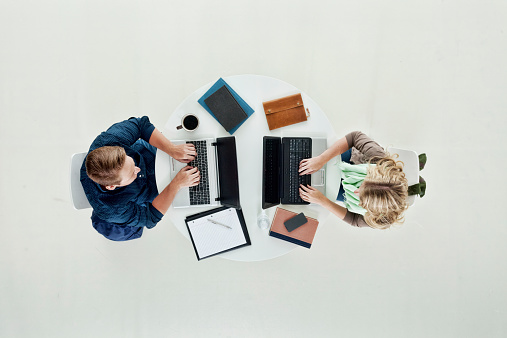 Above view of two students working on laptophttp://www.twodozendesign.info/i/1.png