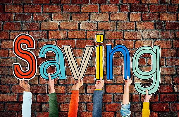 istock Group of Diverse People Holding the Word Saving 513992463