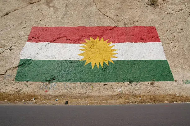 Kurdish national flag by the local road in North Iraq