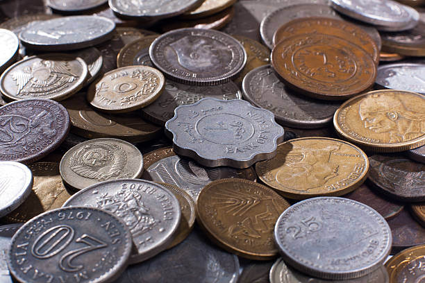 istock pile of coins (selective focus used) 513992588
