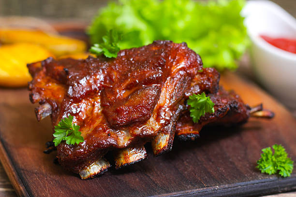 istock Appetizing rosy and barbecued lamb ribs seasoned 513994524