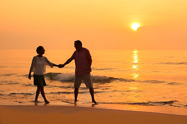 istock Senior couple at golden beach 513995942