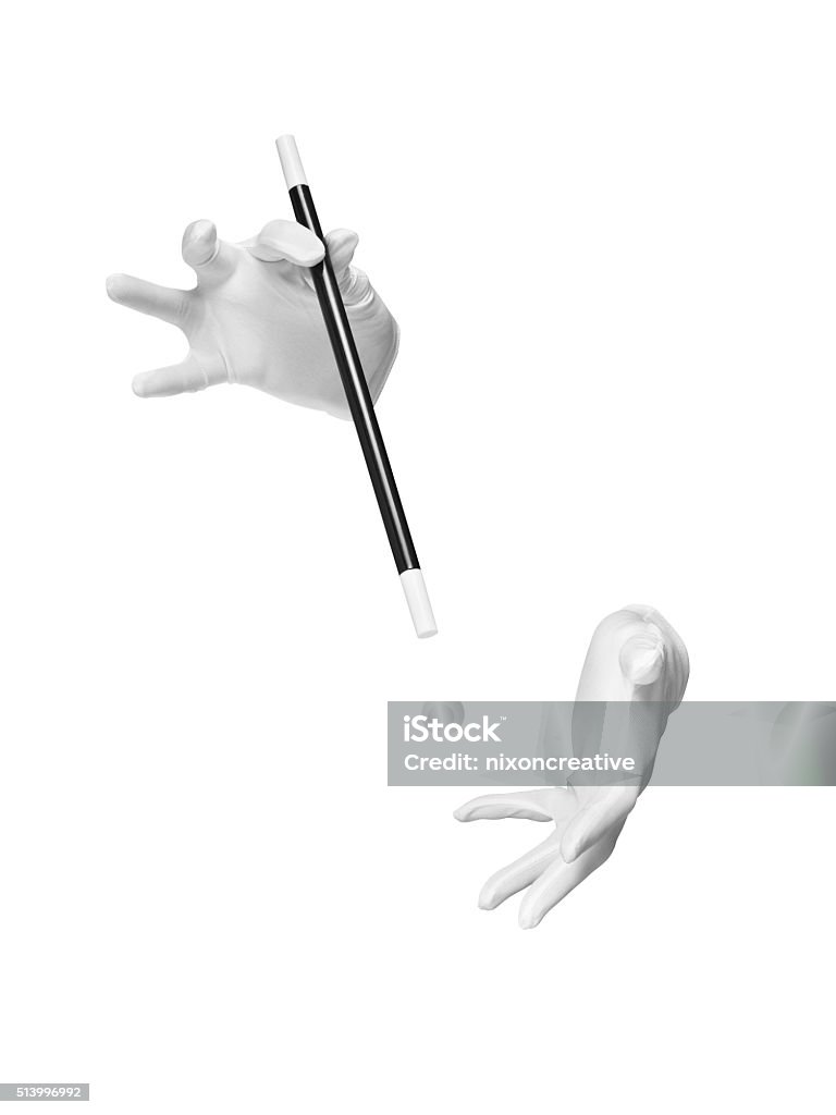 magic wand trick gloves cut out - Stock Image shot of invisible magicians gloved hands with a magic wand during performance of a trick or illusion isolated on a white background with a clipping path. Magician Stock Photo