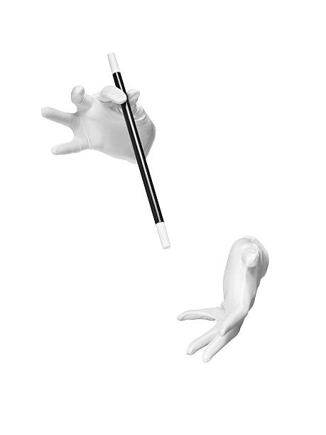 magic wand trick gloves cut out - Stock Image shot of invisible magicians gloved hands with a magic wand during performance of a trick or illusion isolated on a white background with a clipping path. magic trick photos stock pictures, royalty-free photos & images