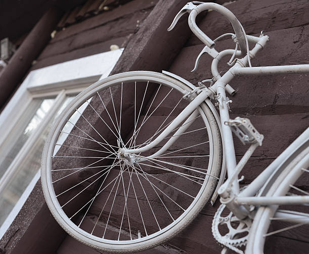 istock White bike hanging on the wall, 513998000