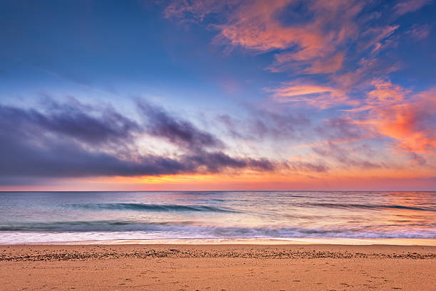 istock Beach with sunlight in sea with sky clouds. 513999846